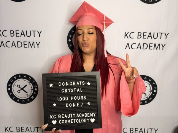 KC Beauty Academy cosmetology graduate celebrating
