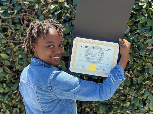 KC Beauty Academy graduate with certificate
