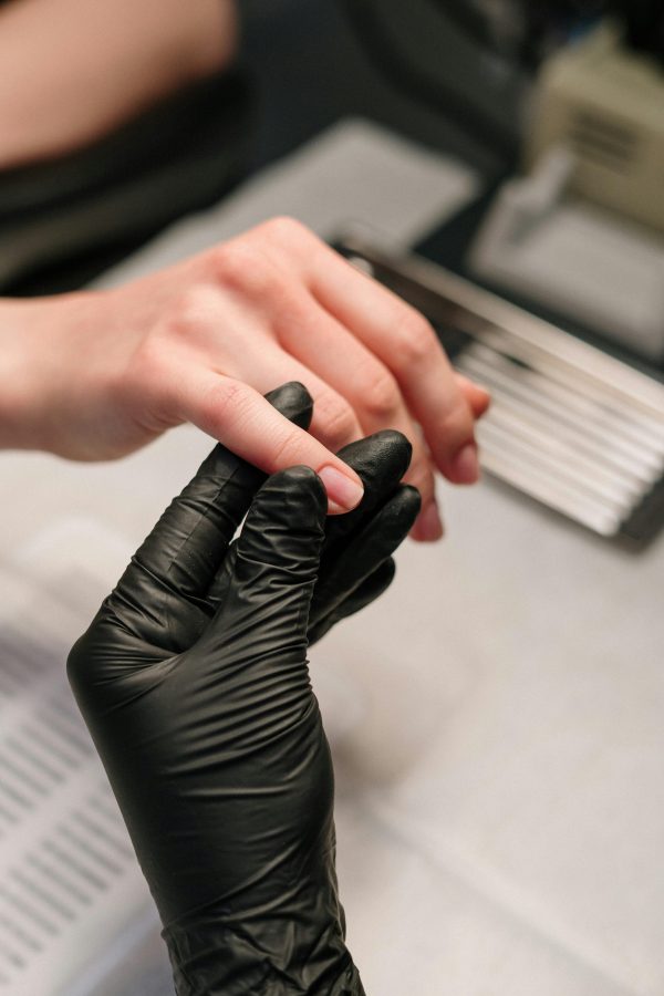 Manicuring student performing a nail service